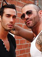 Jonathan Agassi’s next seedy sighting is none other than the burly hunk Junior Stellano seducing muscled sex-god Alexy Tyler. Alexy’s body is a sculpted work of art, and in no time at all, Junior turns him around, pulls down his pants, and worships hi